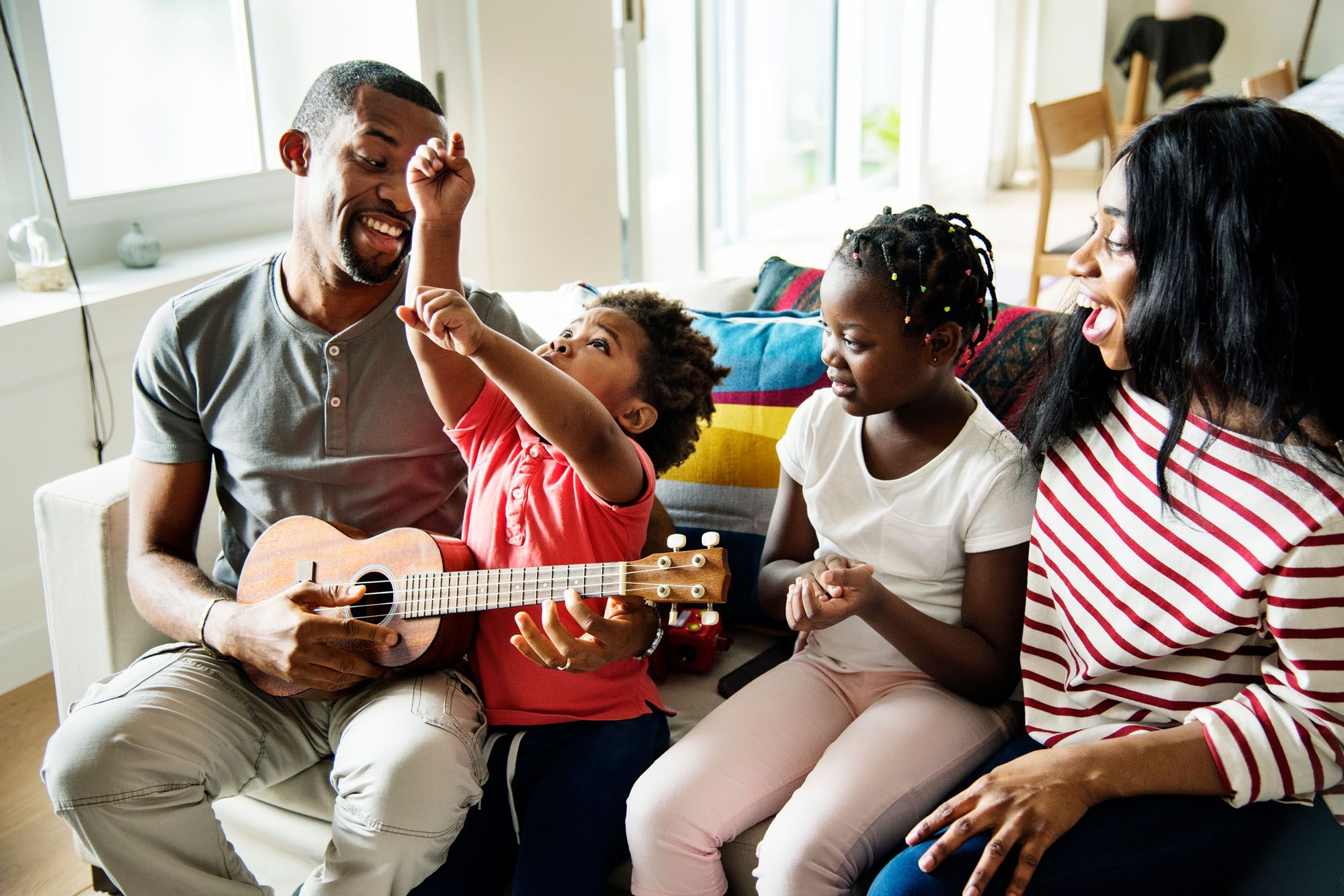 Parents and children having family music time together